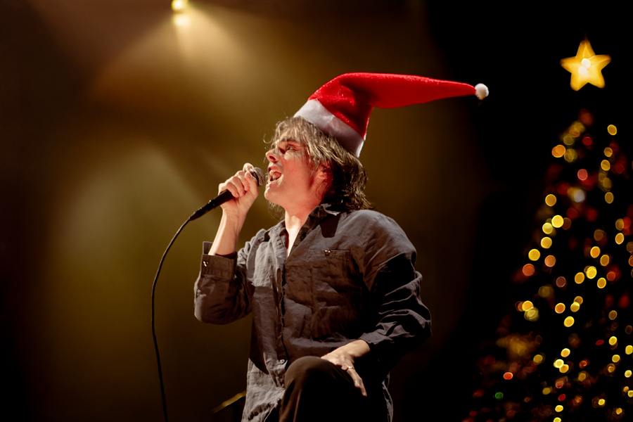 My Chemical Romance Christmas, MCE, Gerard Way in Santa hat in front of a Christmas tree